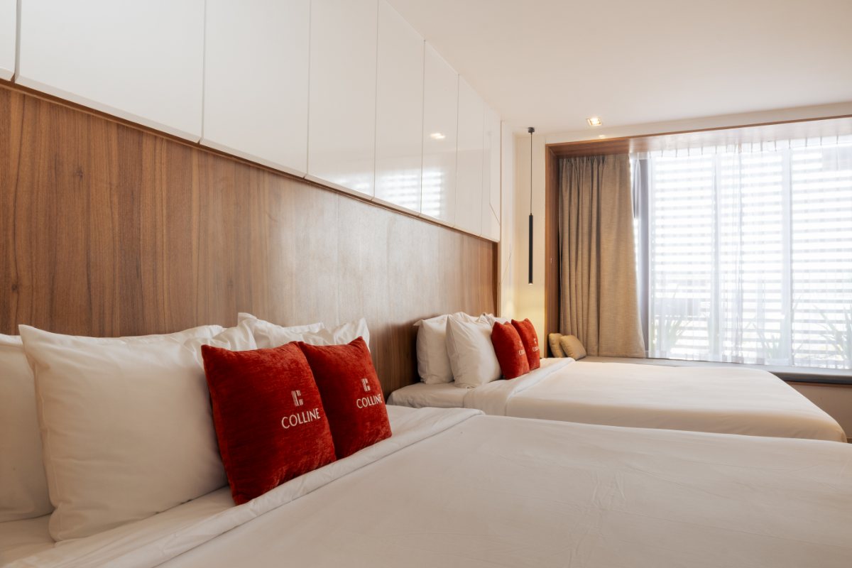 Two double beds in the Deluxe Family room at Colline Dalat