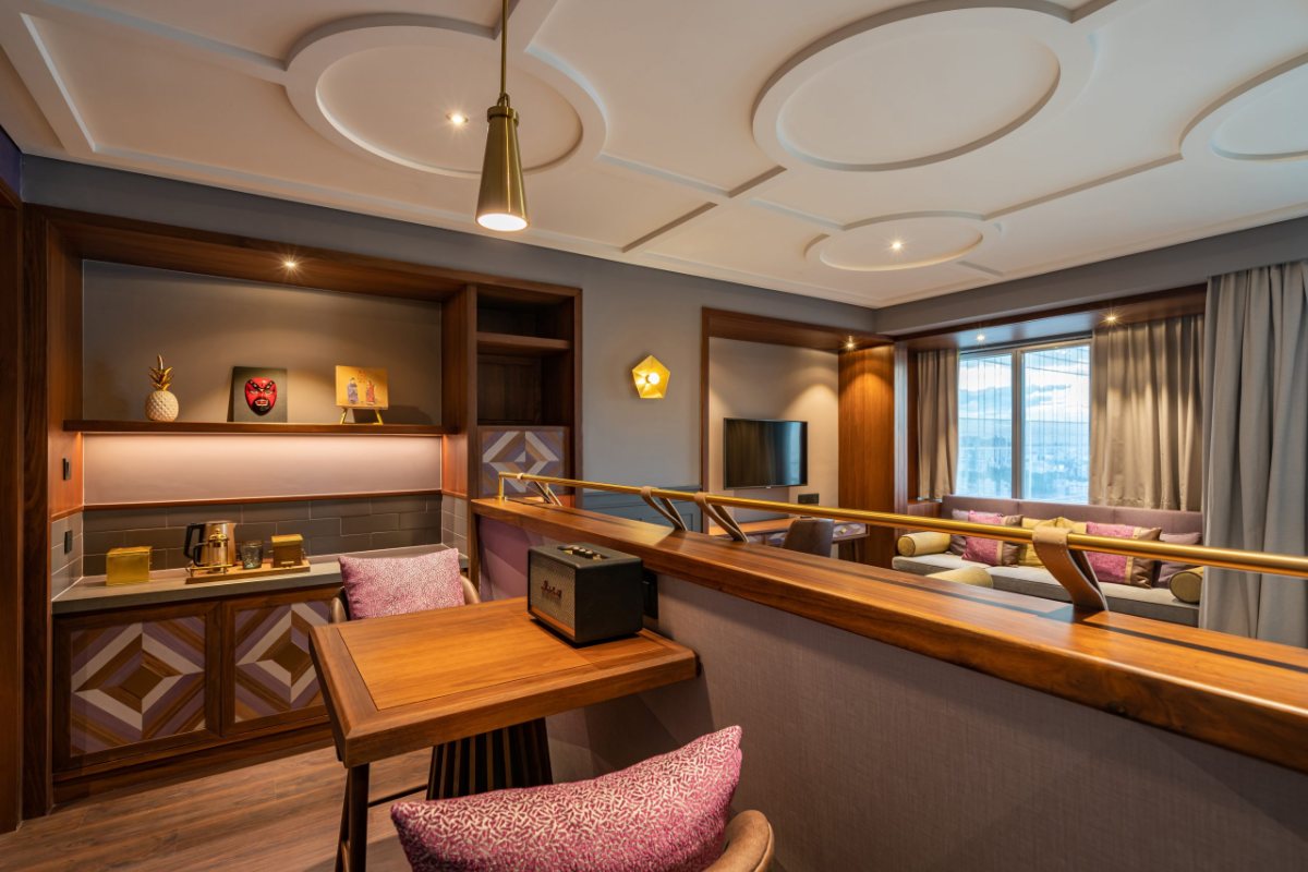 Desk and wardrobe in the Deluxe room at Fusion Original Saigon Centre