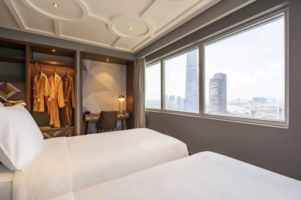 Twin bedroom of the Two-Bedroom Executive Suite at Fusion Original Saigon Centre