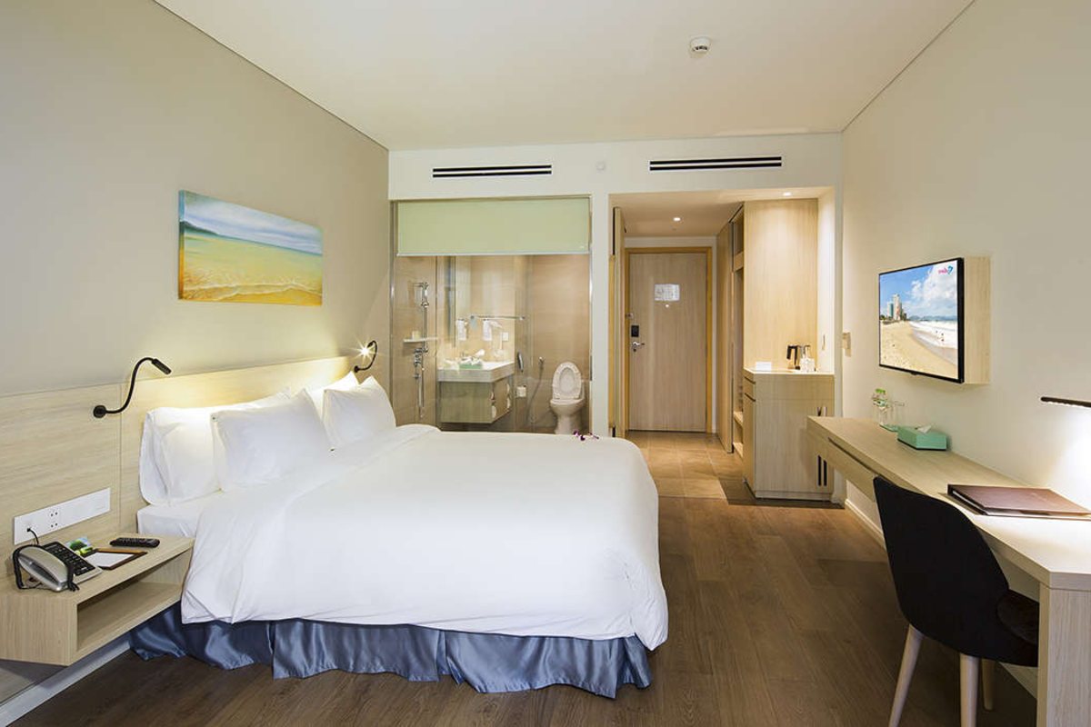 Deluxe room with two single beds at Liberty Central Nha Trang