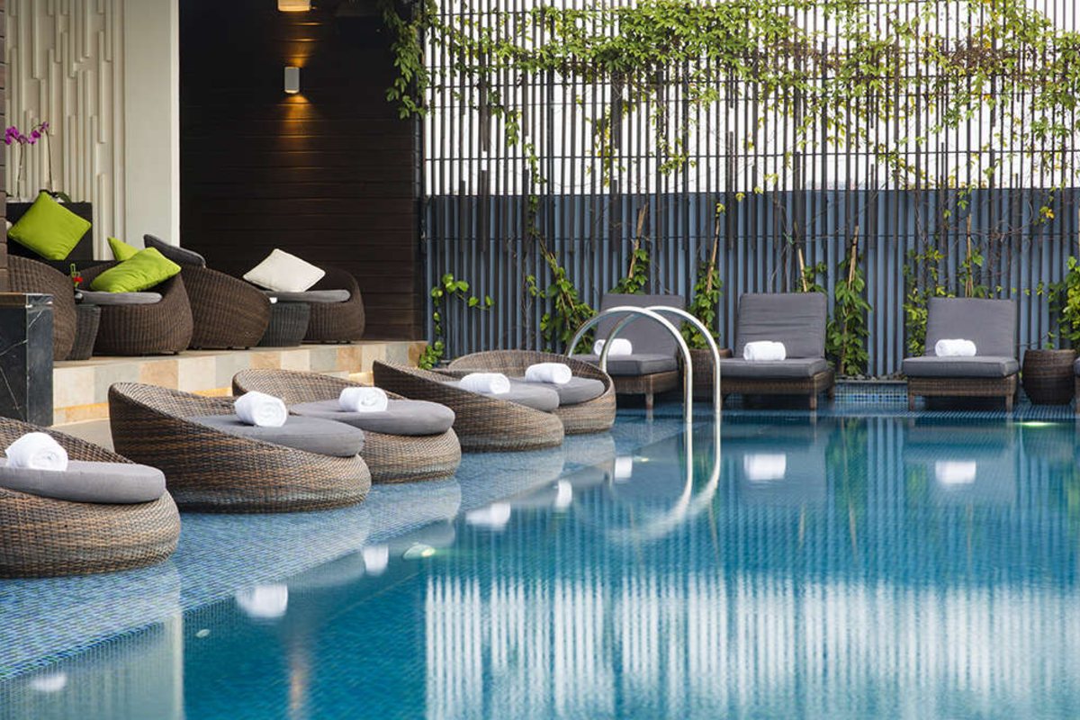 Pool loungers on the rooftop of Liberty Central Saigon Riverside