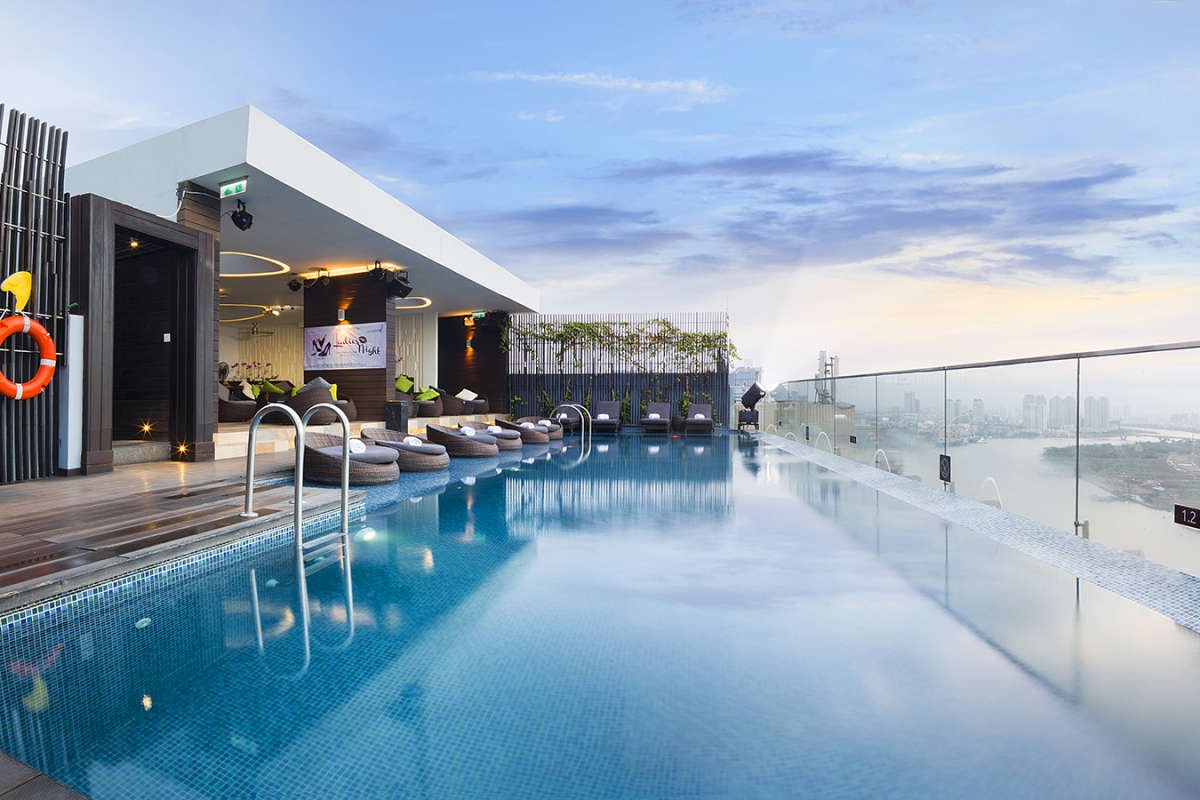 Rooftop pool with city view at Liberty Central Saigon Riverside