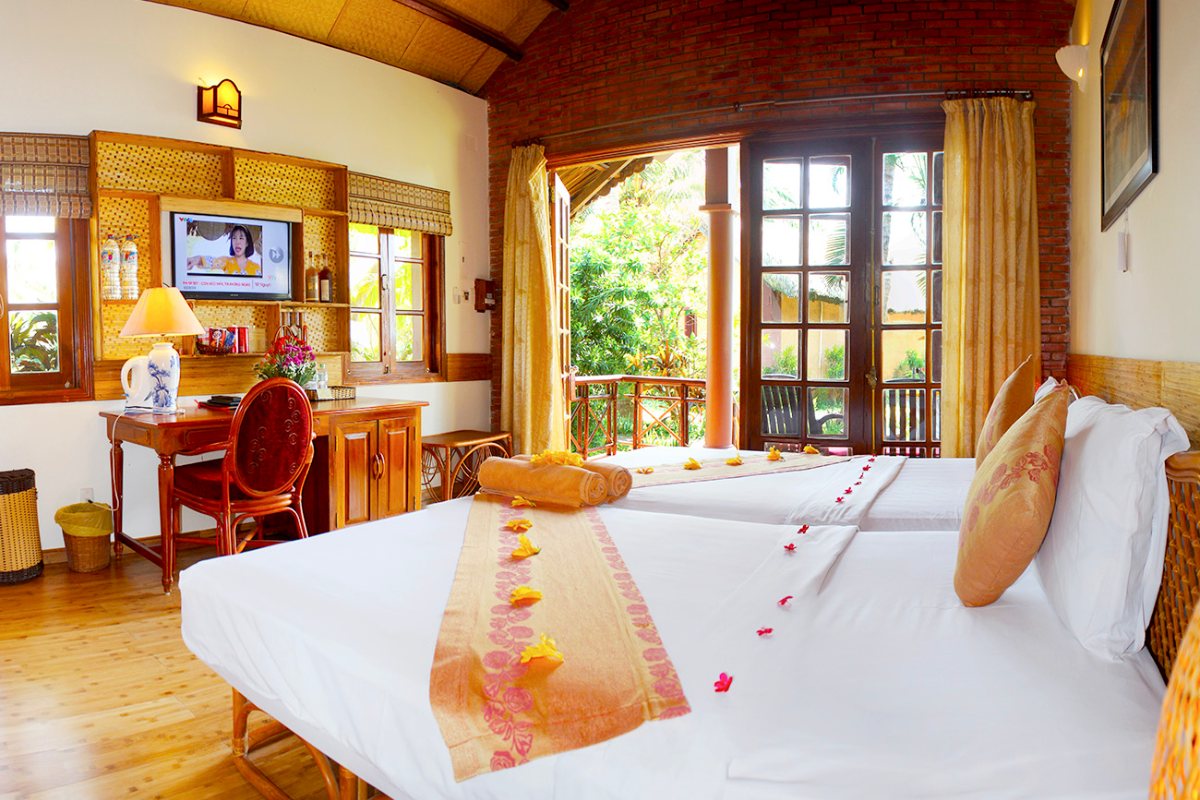 Bed in the Sea View Bungalow at Little Mui Ne Cottages