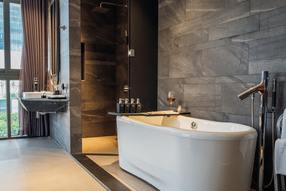 Bathroom with freestanding bathtub at M Hotel Saigon