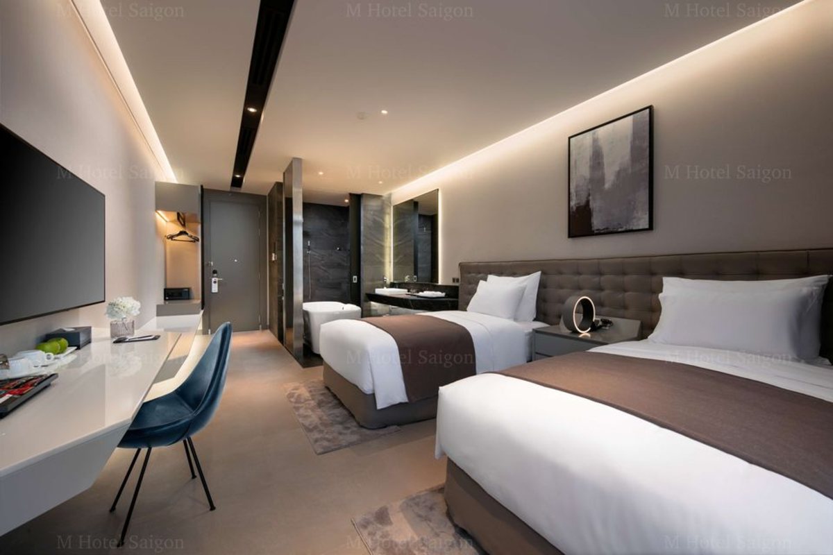 Two single beds in the Culture View Suite Twin at M Hotel Saigon