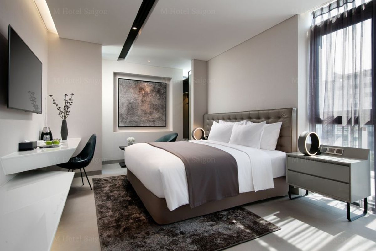 King bed in the Junior Contemporary Suite at M Hotel Saigon