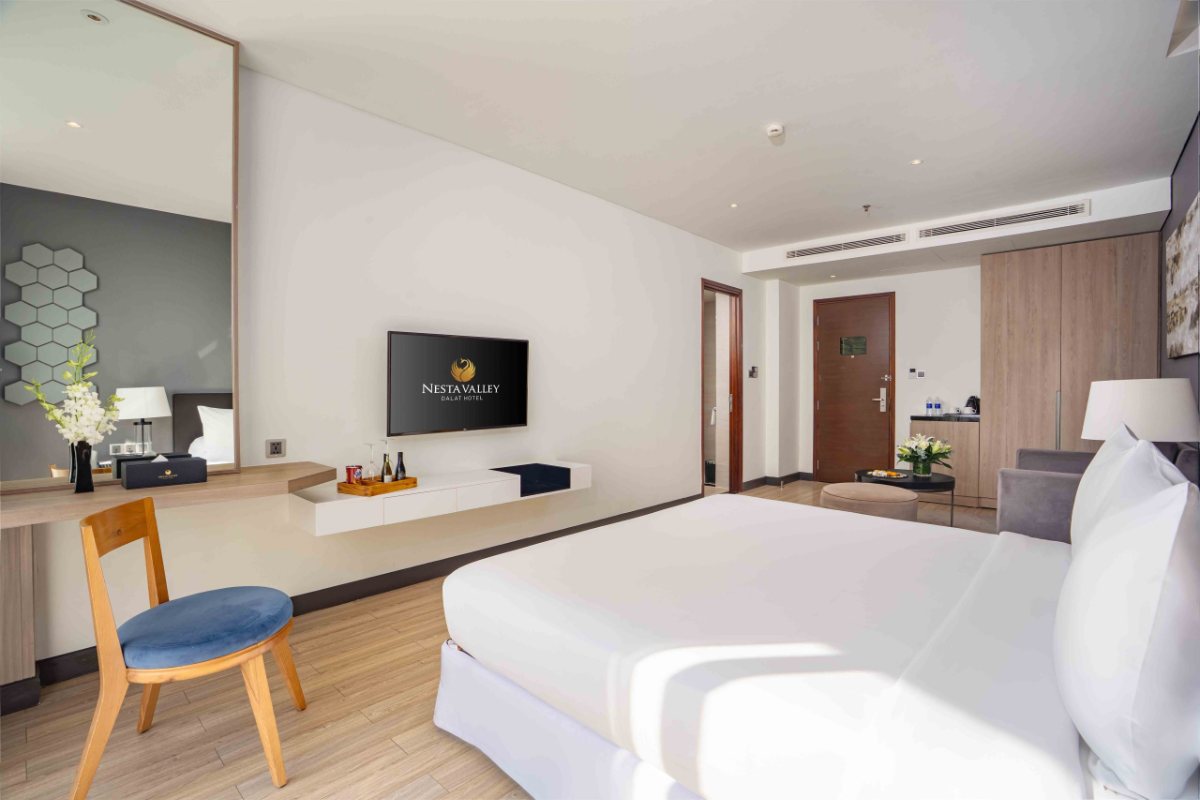 Bed in the Deluxe room at Nesta Valley Dalat