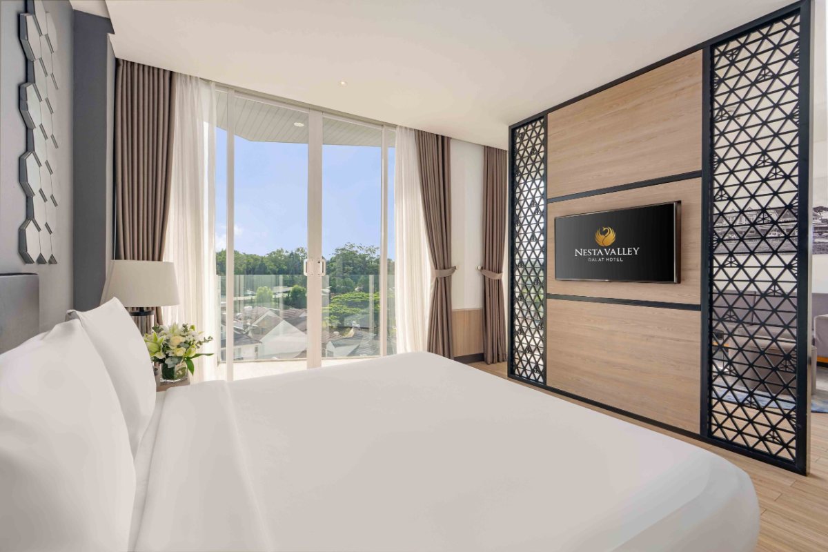 Bed in the Premium Deluxe room at Nesta Valley Dalat