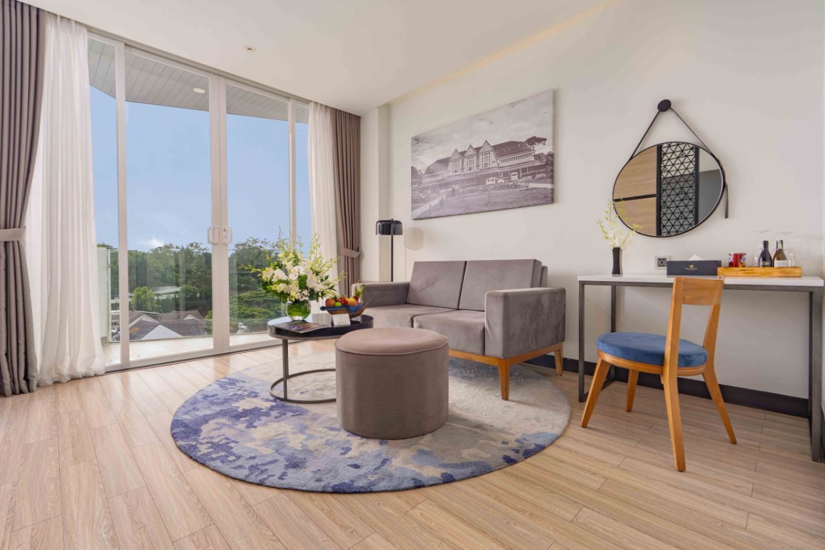 Seating area in the Premium Deluxe room at Nesta Valley Dalat