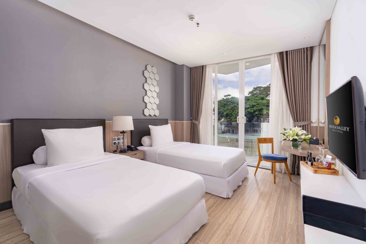 Bed in the Superior room at Nesta Valley Dalat