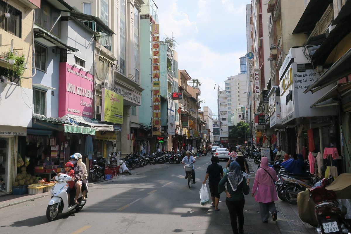 Shops and motorbikes on Nguyen An Ninh Street beside Ben Thanh Market, Saigon