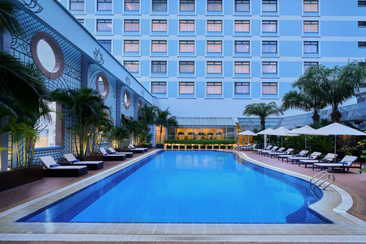 Swimming pool in the evening at Sheraton Saigon Grand Opera Hotel