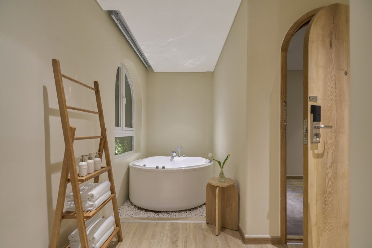 Green Papaya room bathroom at Silverland Mây Hotel