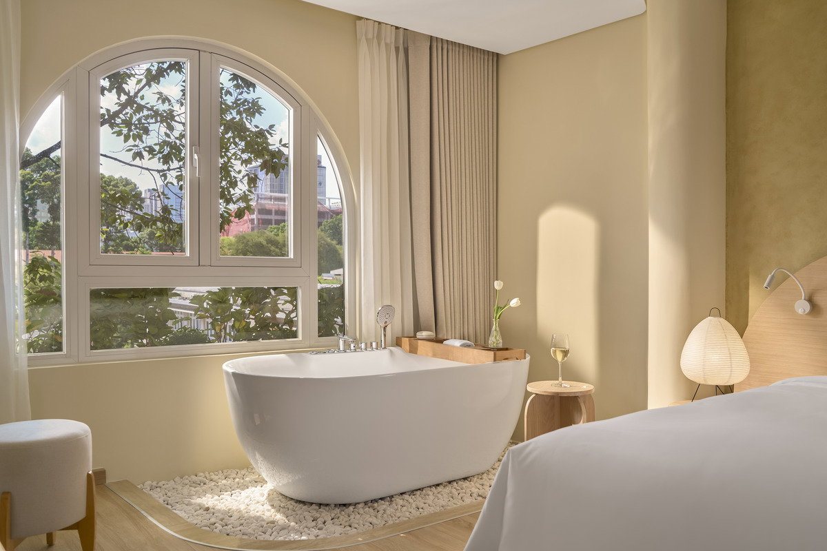 Deep soaking tub in the Green Papaya room at Silverland Mây Hotel