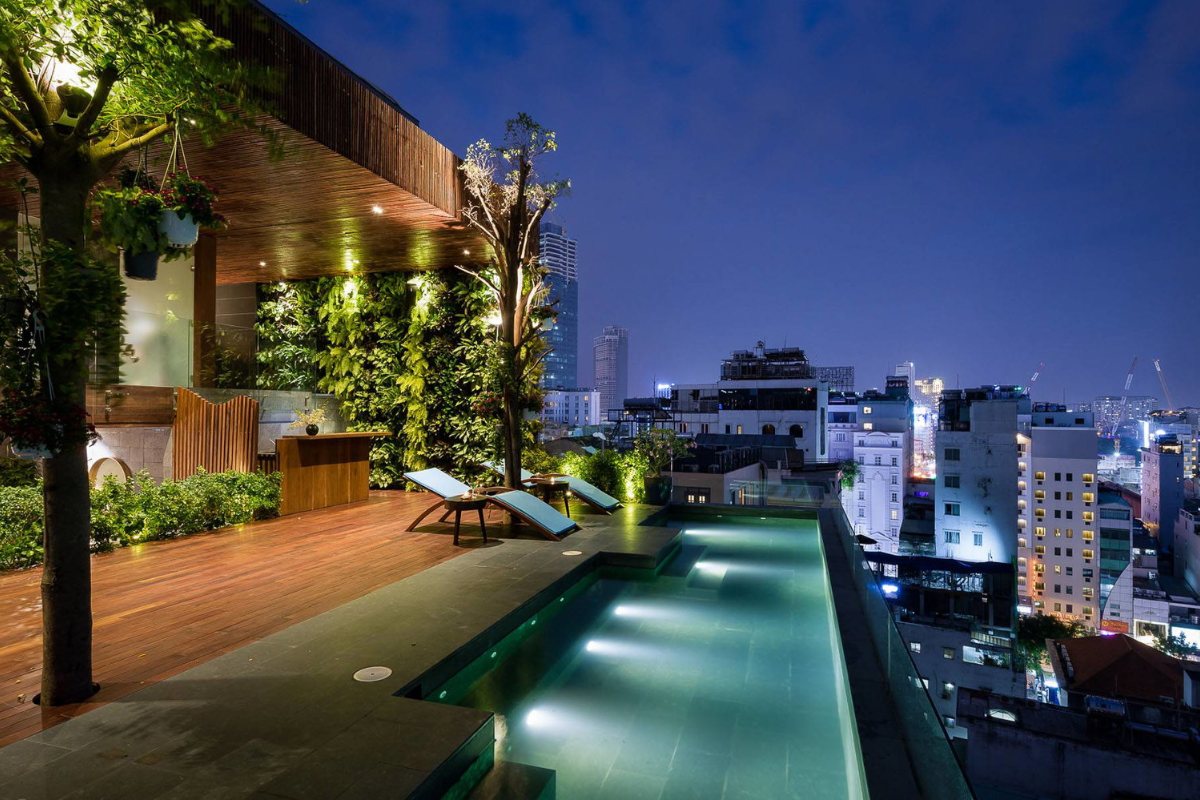 Silverland Yen Hotel Rooftop pool at night over central Saigon at Silverland Yen Hotel