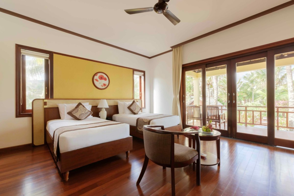 Bed in the Deluxe Garden View room at Sunny Beach Resort & Spa