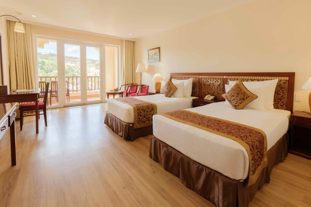 Bed in the Deluxe Hill View room at Sunny Beach Resort & Spa