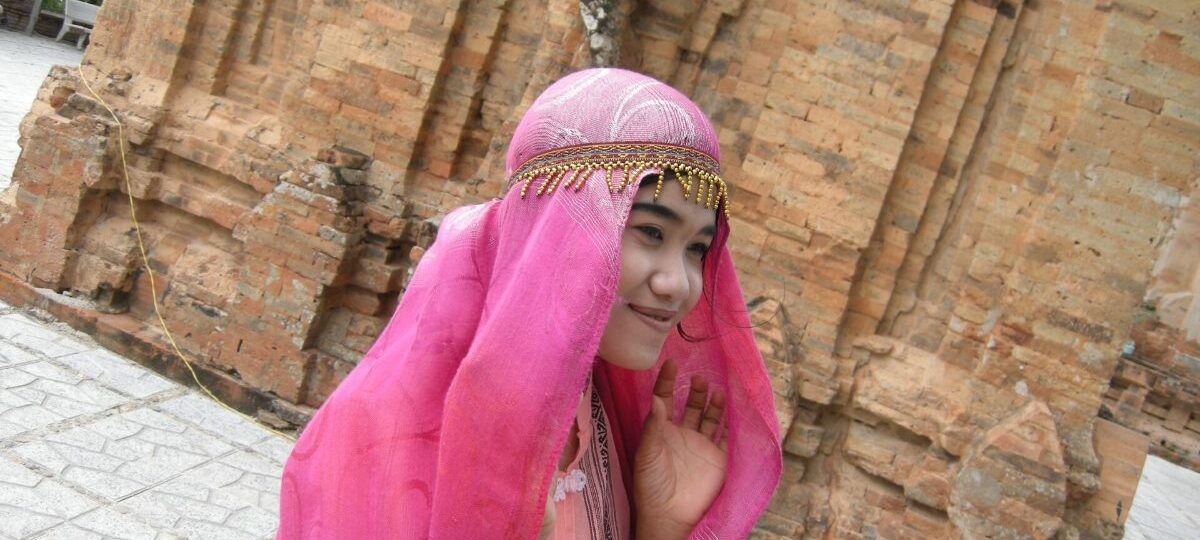 Muslim People in Vietnam 2026: Who Are Vietnamese Muslims? Cham Islam, Bani & Communities Cham woman in traditional dress and headscarf, Vietnam