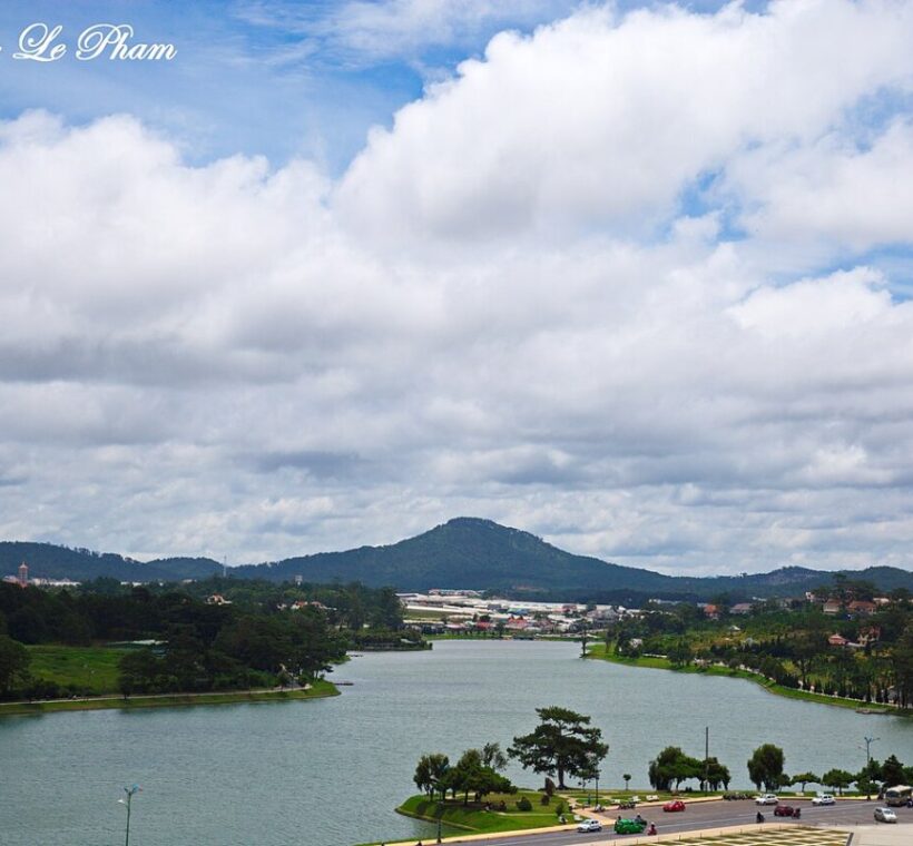 Xuan Huong Lake in central Da Lat with pine hills and Lang Biang mountain behind